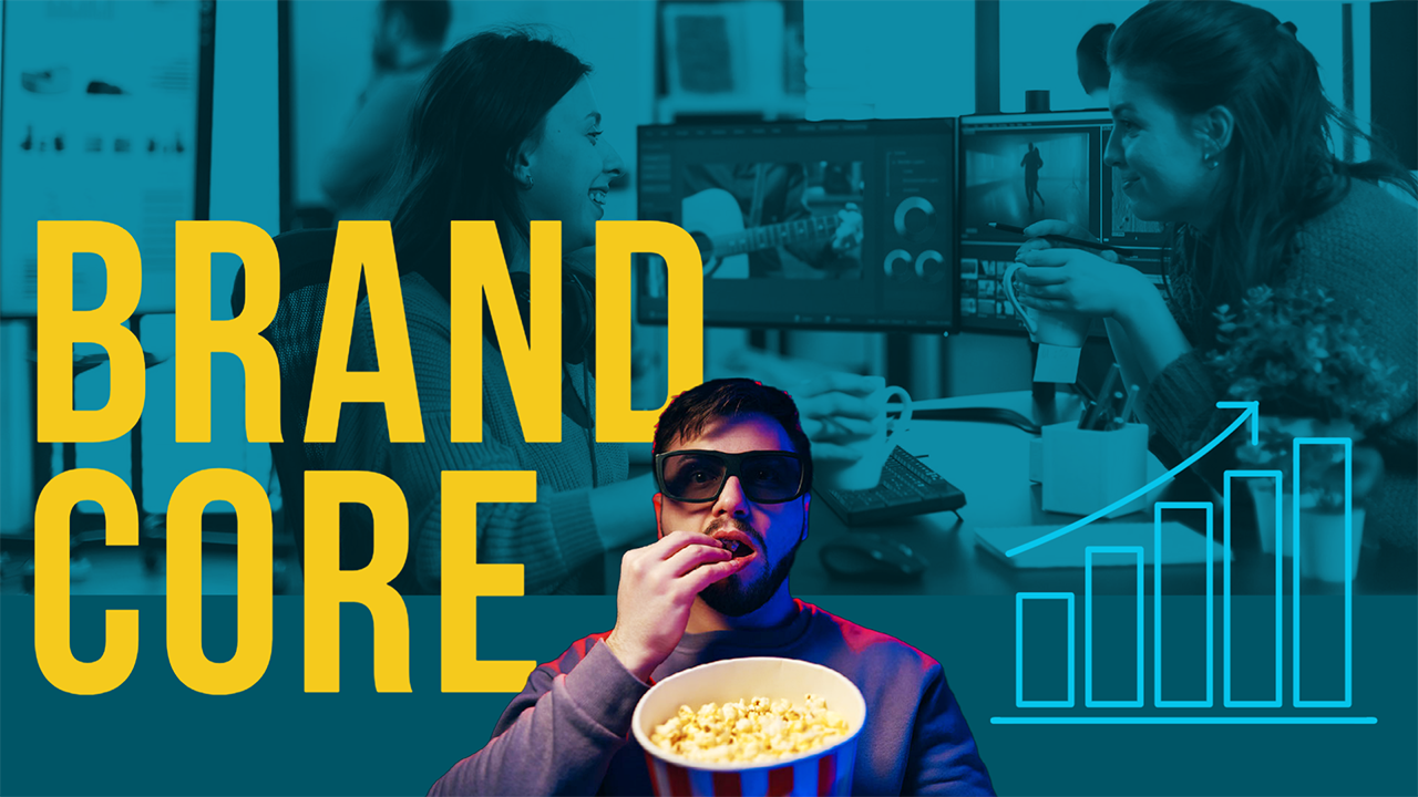 While eating popcorn a man is watching a movie scene about 2 women editing a video